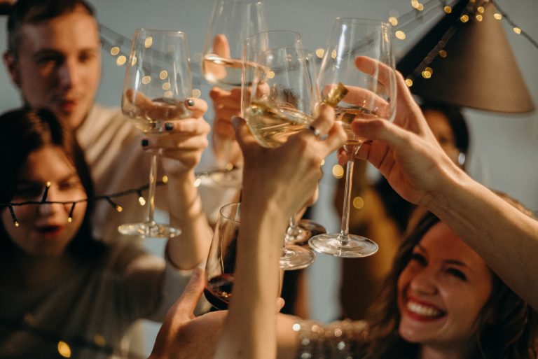 selective-focus-photography-of-several-people-cheering-wine-3171815